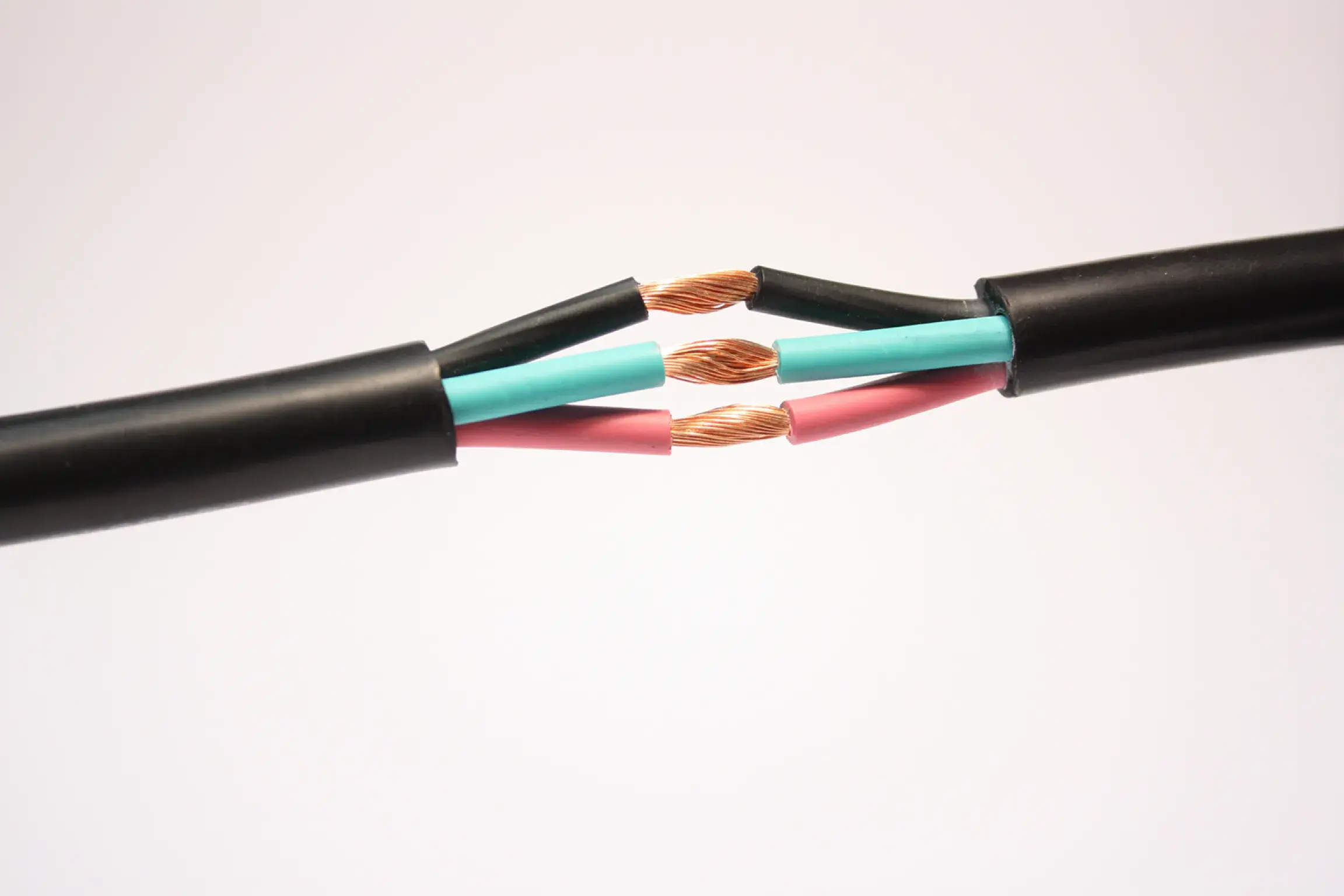 Three wires blue, black and pink colored inside one wrapper that is in black color.